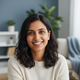 Portrait of a smiling person in their late 30s to early 40s, conveying trust and satisfaction.